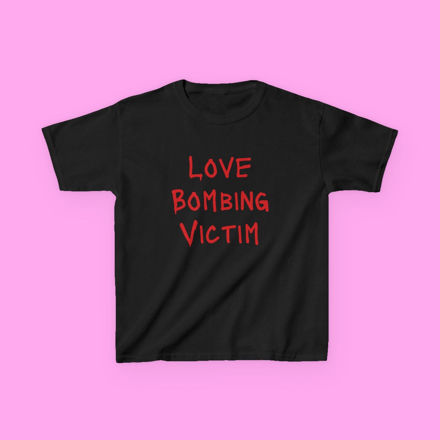 Love bombing victim baby tee