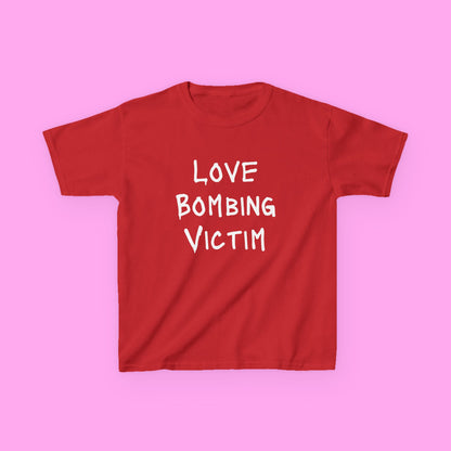 Love bombing victim baby tee