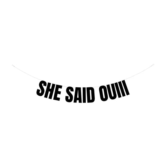She said Ouiii banner